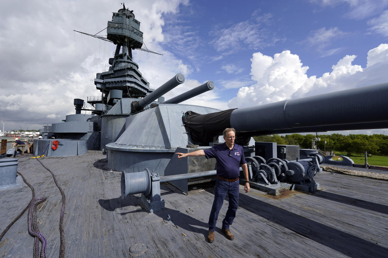 Tony Gregory, president and CEO of the Battleship Texas Foundation, stands on the deck as he talks about the upcoming move and repairs Tuesday, Aug. 30, 2022, in La Porte, Texas. The USS Texas, which was commissioned in 1914 and served in both World War I and World War II, is scheduled to be towed down the Houston Ship Channel Wednesday to a dry dock in Galveston where it will undergo an extensive $35 million repair. (AP Photo/David J. Phillip)