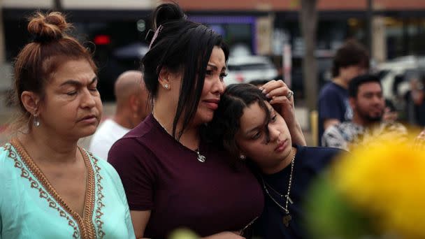 PHOTO: Vanessa Marian Meneses hugs her niece Valeska Farias as they visit a memorial next to the Allen Premium Outlets, May 7, 2023 in Allen, Texas. (Joe Raedle/Getty Images)