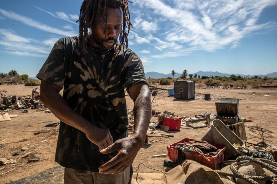 A man in a homeless encampment along Highway 95 in Blythe.