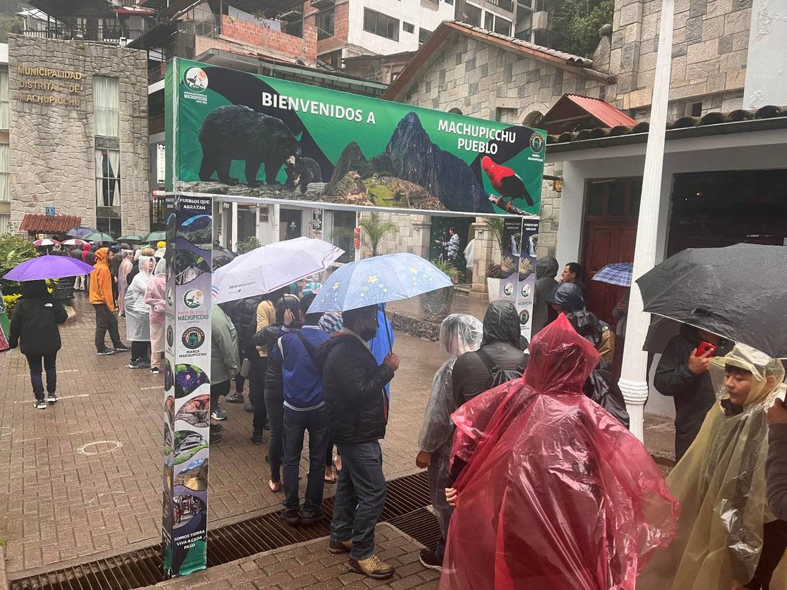 Stranded tourists wait in line to leave Aguas Calientes, the town that serves as a base camp for Machu Picchu. 