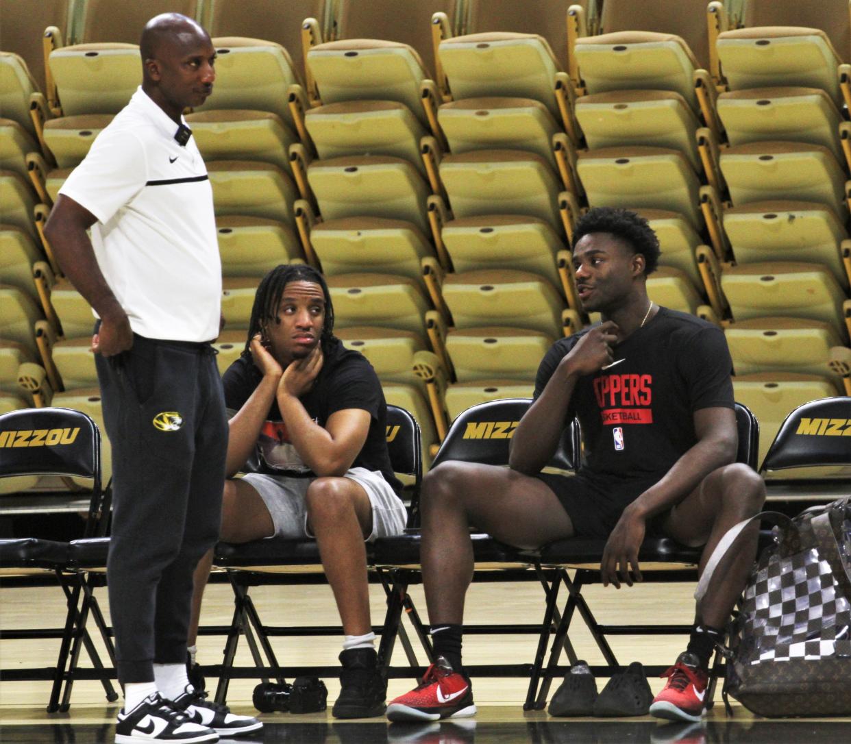 Former Missouri star, and current Los Angeles Clipper, Kobe Brown, far right, talks with MU basketball associate head coach Charlton Young, far left, during an open practice on July 22, 2023, in Columbia, Mo.
