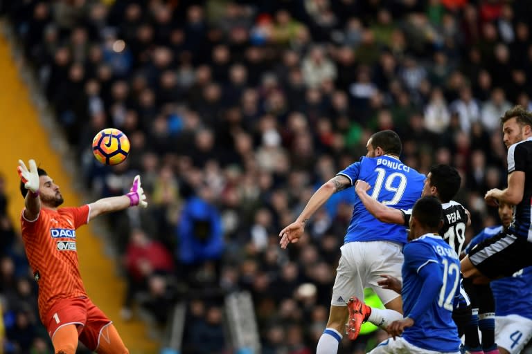 Juventus' Italian defender Leonardo Bonucci heads to score during the Italian Serie A football match Udinese vs Juventus at the Dacia Arena Stadium in Udine on March 5, 2017