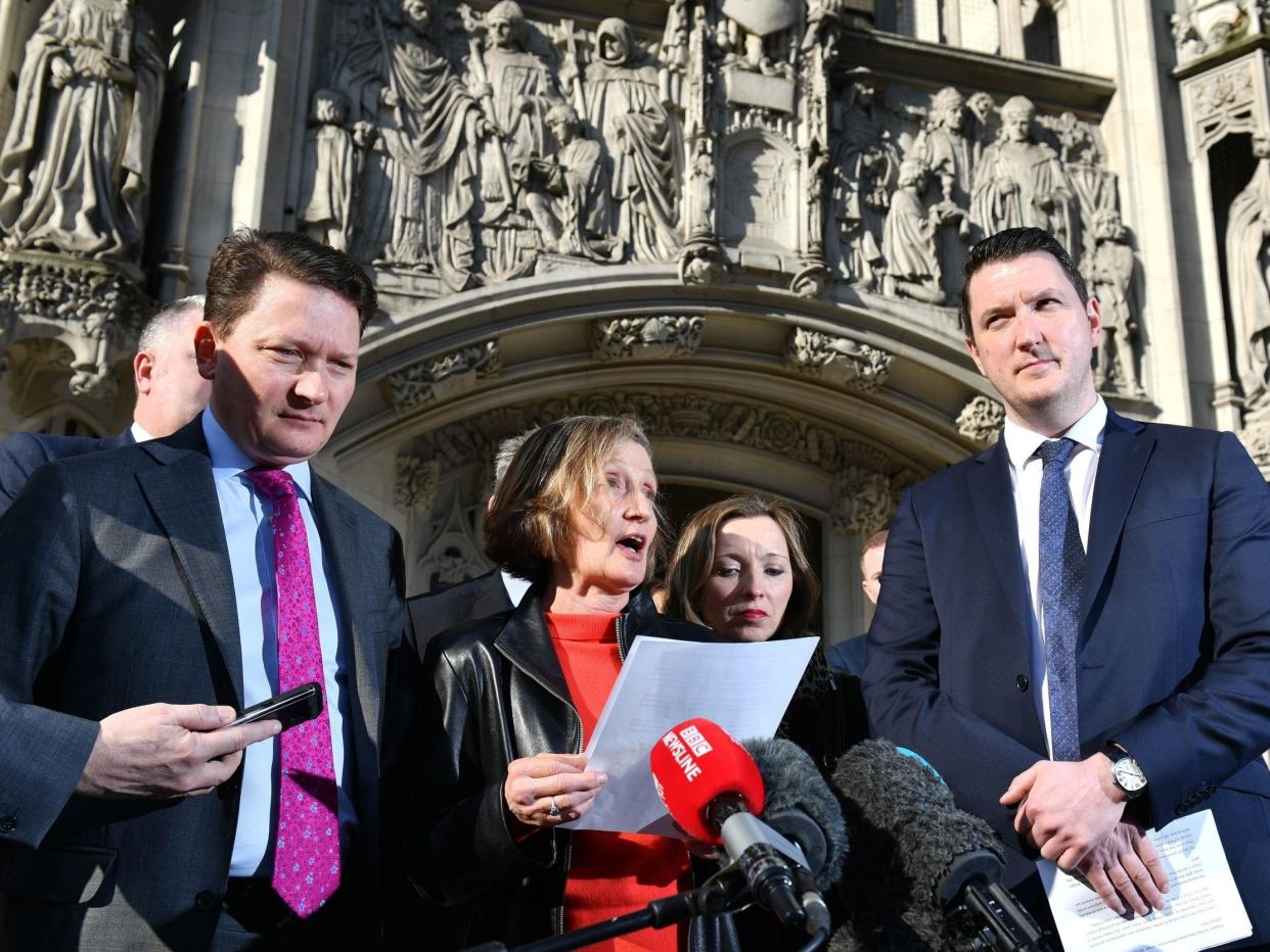 <p>Geraldine Finucane, widow of murdered solicitor Pat Finucane, accompanied by sons John (right) and Michael (left) outside UK Supreme Court</p> (PA)