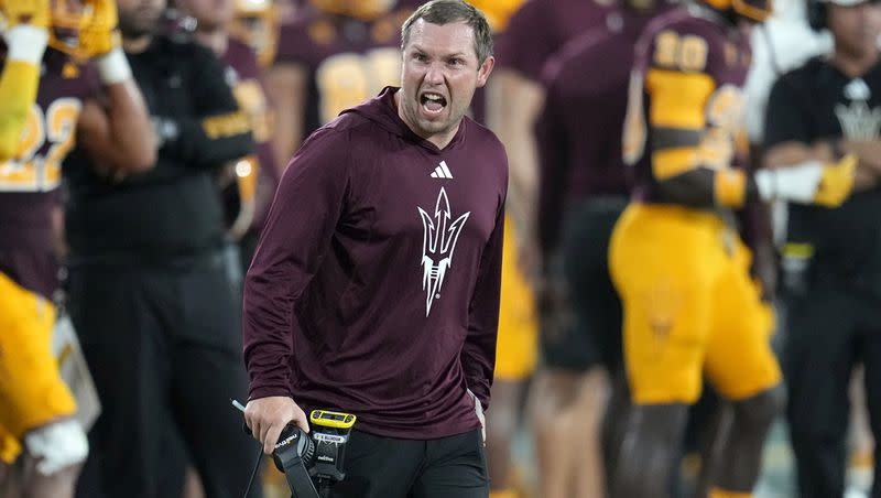 Arizona State coach Kenny Dillingham shouts at officials during a game against Colorado, Saturday, Oct. 7, 2023, in Tempe, Ariz. As the youngest NCAA Division I coach in the country, Dillingham is hoping to build the type of program Kyle Whittingham has built at Utah.