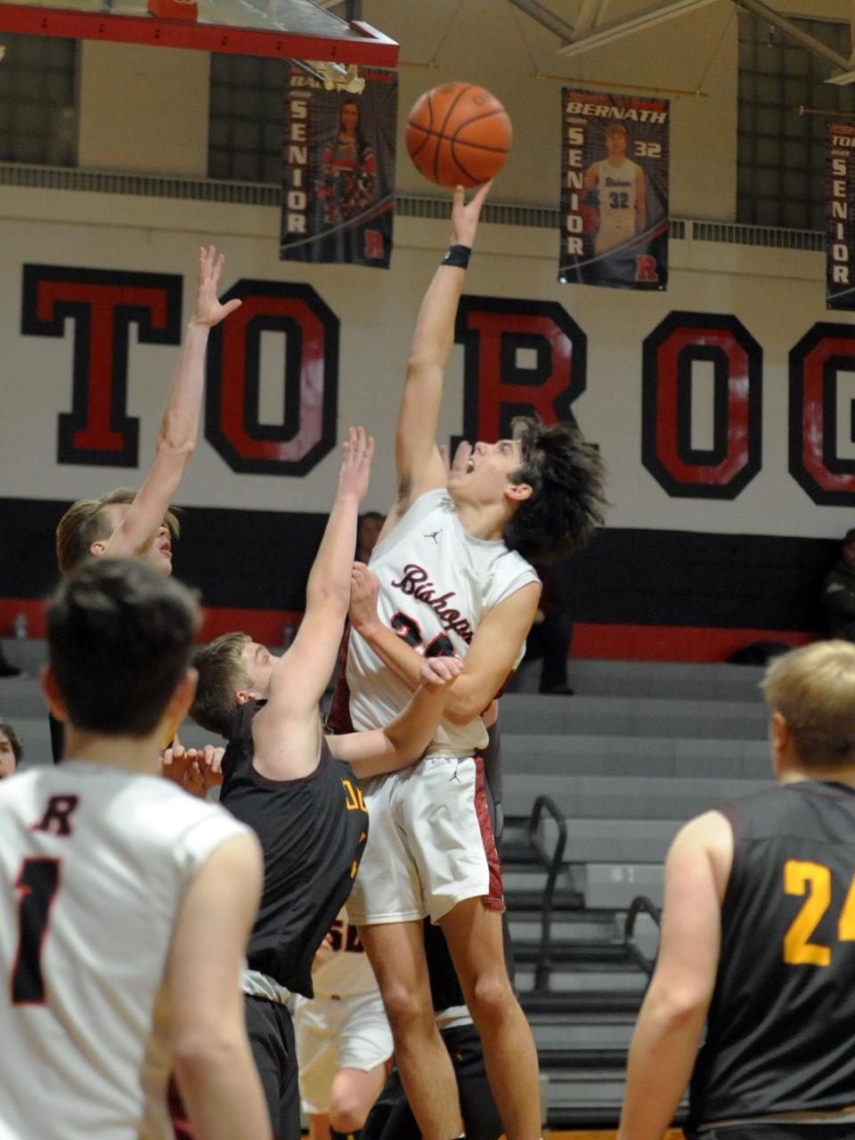 Weston Hartman shoots a floater during Rosecrans' win against visiting Berne Union last season. Hartman and Grady Labishak will lead the charge for the Bishops.
