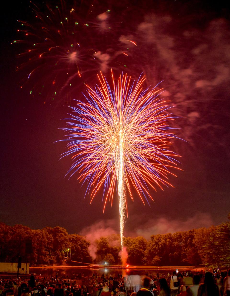 Fireworks explode over Glen Oak Lagoon during the annual 3rd of July Fireworks Celebration on Monday, July 3, 2023 at Glen Oak Park in Peoria.