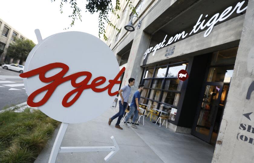 LOS ANGELES, CA - AUGUST 29, 2019 Patrons enter the cafe Go Get Em Tiger located at The ROW on 777 South Alameda St. in Los Angeles operated by owners Kyle Glanville and Charles Babinski on August 29, 2019.(Al Seib / Los Angeles Times)