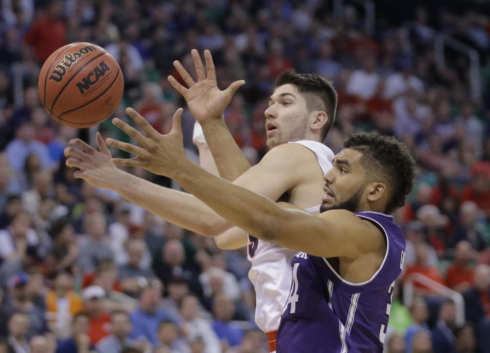 Gonzaga forward Killian Tillie, left, and Northwestern guard Sanjay Lumpkin (34) battle for a rebound during the second half of a second-round college basketball game in the men's NCAA Tournament Saturday, March 18, 2017, in Salt Lake City. (AP Photo/Rick Bowmer)