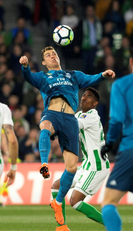 Eye on the ball: Cristiano Ronaldo in a challenge with Real Betis' Junior Firpo