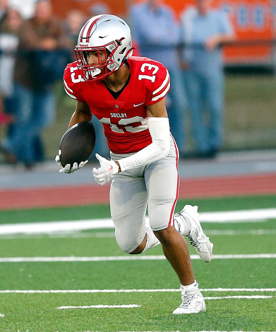 Shelby High School's Issaiah Ramsey (13) carries the ball against Galion High School during high school football action at Shelby High School, Friday, Sept. 15, 2023. TOM E. PUSKAR/MANSFIELD NEWS JOURNAL