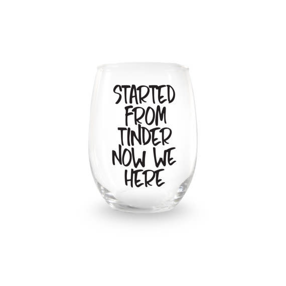 Shop it <a href="https://www.etsy.com/listing/508613833/started-from-tinder-now-we-here-stemless?ga_order=most_relevant&amp;ga_search_type=all&amp;ga_view_type=gallery&amp;ga_search_query=tinder%20gifts&amp;ref=sc_gallery_3&amp;plkey=b5e443fd22888127809fec5550a3f7360bd36a97:508613833" target="_blank">here</a>.&nbsp;