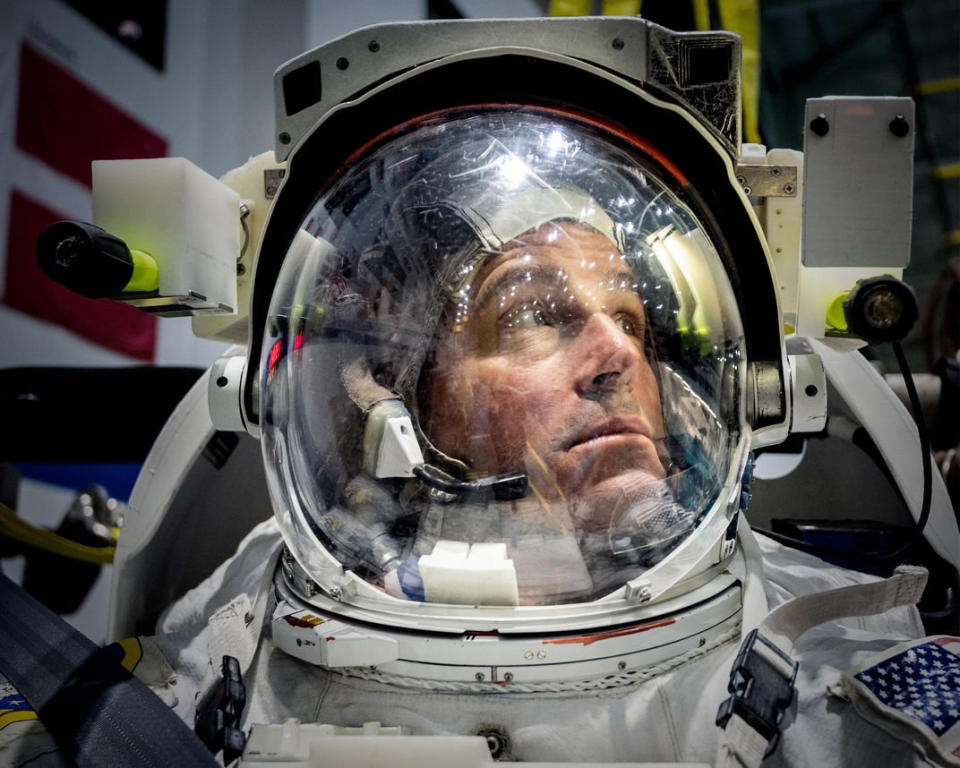 Runner up: Astronaut Reid Wiseman takes in his surroundings as he is about to be lowered into the pool-like Neutral Buoyancy Lab