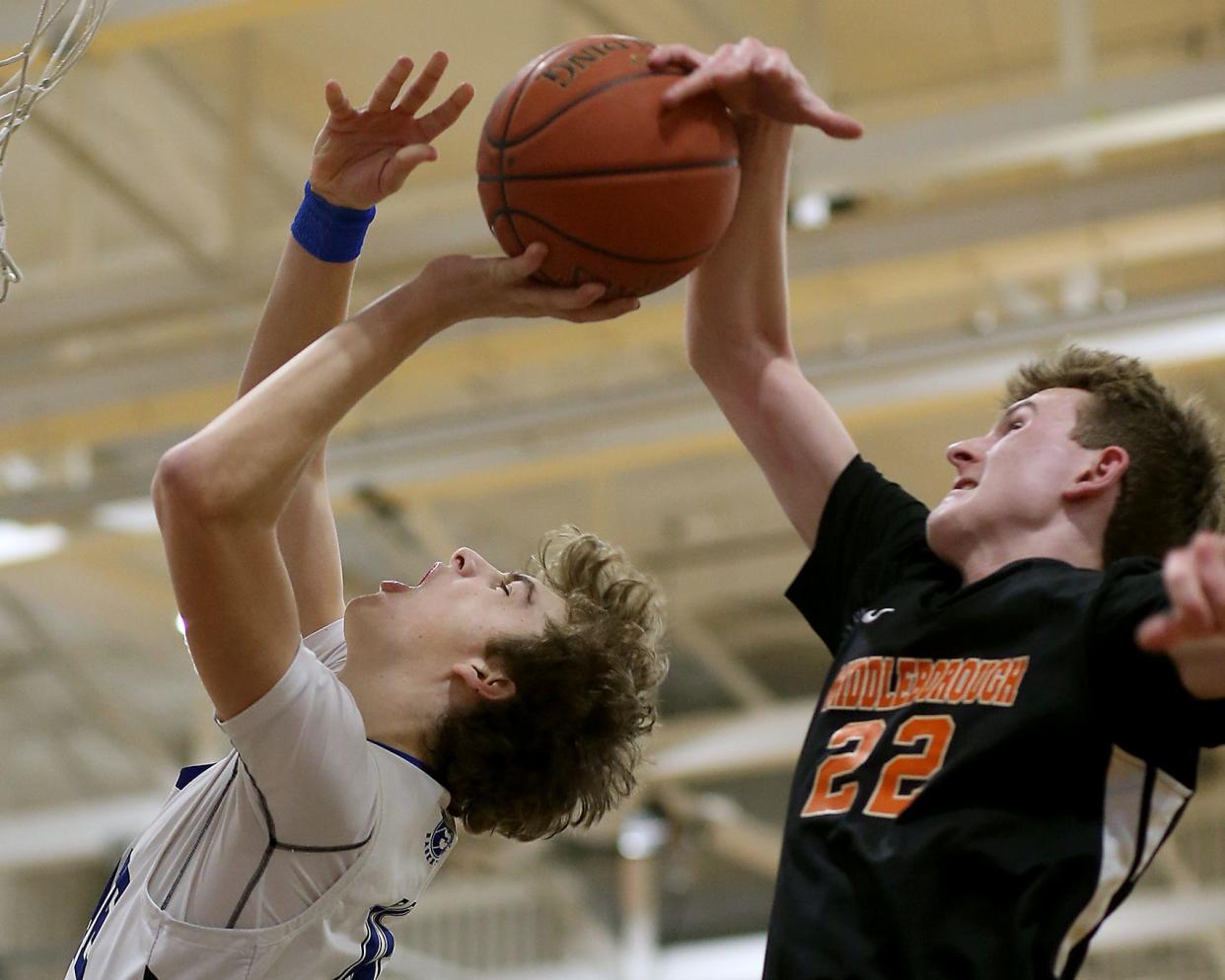 Middleborough's Matt Youngquist appears to block the shot of Scituate's Michael Porter during first quarter action of their game in the Round of 32 game in the Division 2 state tournament at Scituate High on Thursday, March 2, 2023.