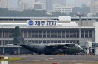 In this Nov. 11, 2018 photo, a South Korea's Air Force cargo plane C-130 carrying boxes of tangerines, is seen before its take off for North Korea at the Jeju International Airport on Jeju Island, South Korea. South Korea has airlifted thousands of boxes of tangerines to North Korea in return for the North's large shipments of pine mushrooms in September.(Park Ji-ho/Yonhap via AP)