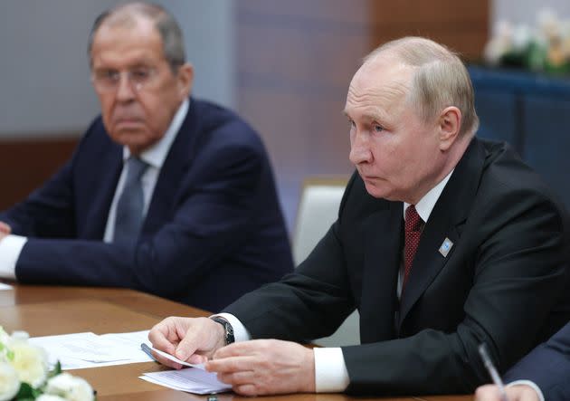 Vladimir Putin and his foreign minister Sergei Lavrov 