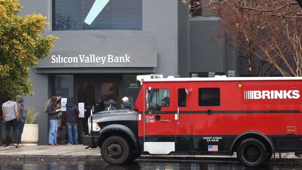 A Brinks armored truck sits parked in front of the shuttered Silicon Valley Bank (SVB) headquarters on March 10, 2023 in Santa Clara, California.