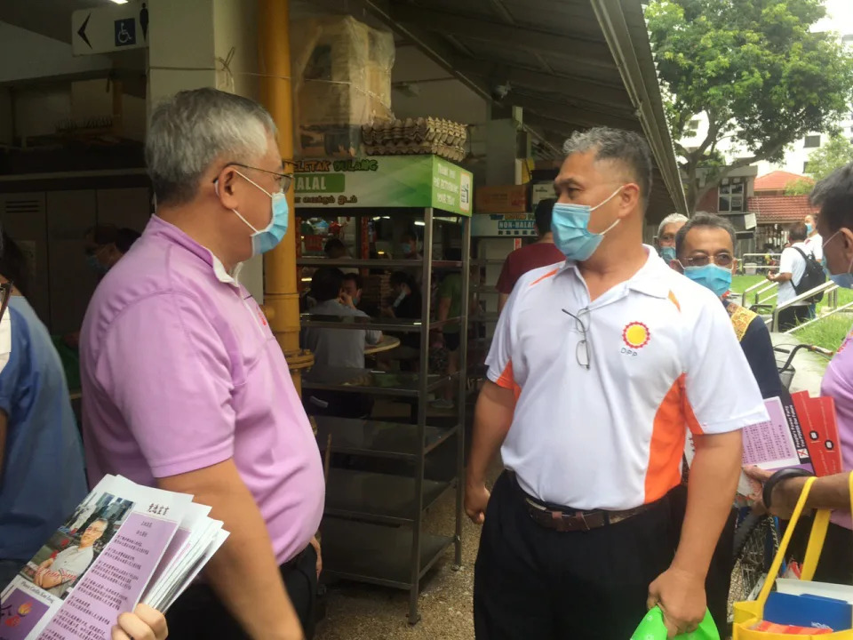 People's Power Party founder Goh Meng Seng with Democratic Progressive Party secretary-general Mohamad Hamim Aliyas at the MacPherson Market & Food Centre on Saturday morning (27 June). (Photo: Christalle Tay / Yahoo News Singapore)