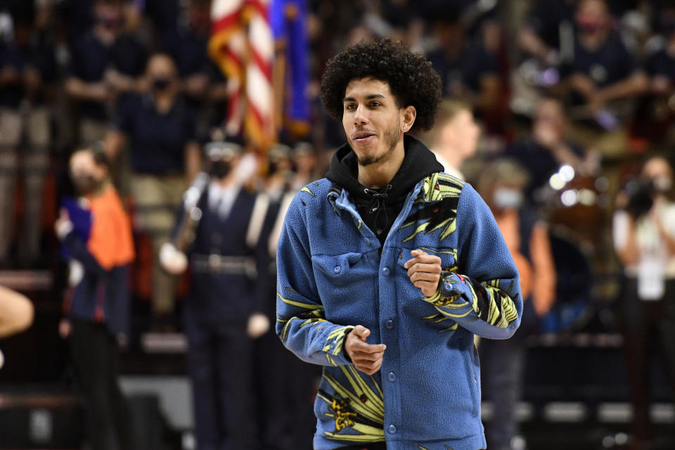 Illinois' Andre Curbelo dances while in street clothes before an NCAA college basketball game against Notre Dame Monday, Nov. 29, 2021, in Champaign, Ill. (AP Photo/Michael Allio)