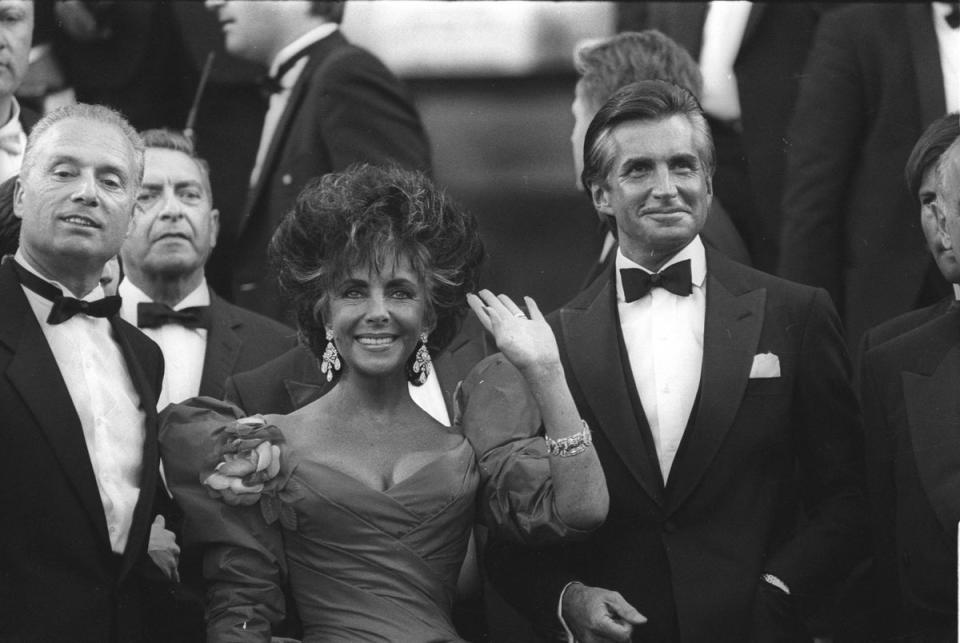 Elizabeth Taylor and George Hamilton arrive at the 40th Cannes on 13 May 1987 (Reuters)