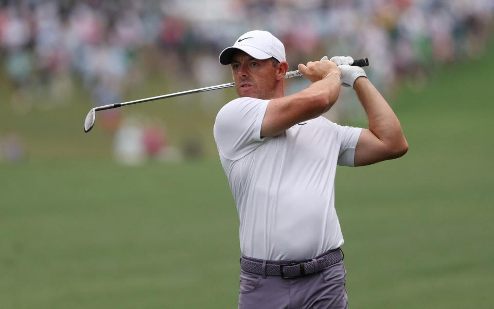 Northern Ireland's Rory McIlroy hits his approach on the 1st hole during the first round