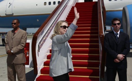 US Secretary of State Hillary Clinton boards a plane in Beijing to head to Bangladesh on May 5. Clinton landed in India on Sunday with hopes of reinvigorating a relationship seen as losing steam despite efforts to bring the world's two largest democracies closer