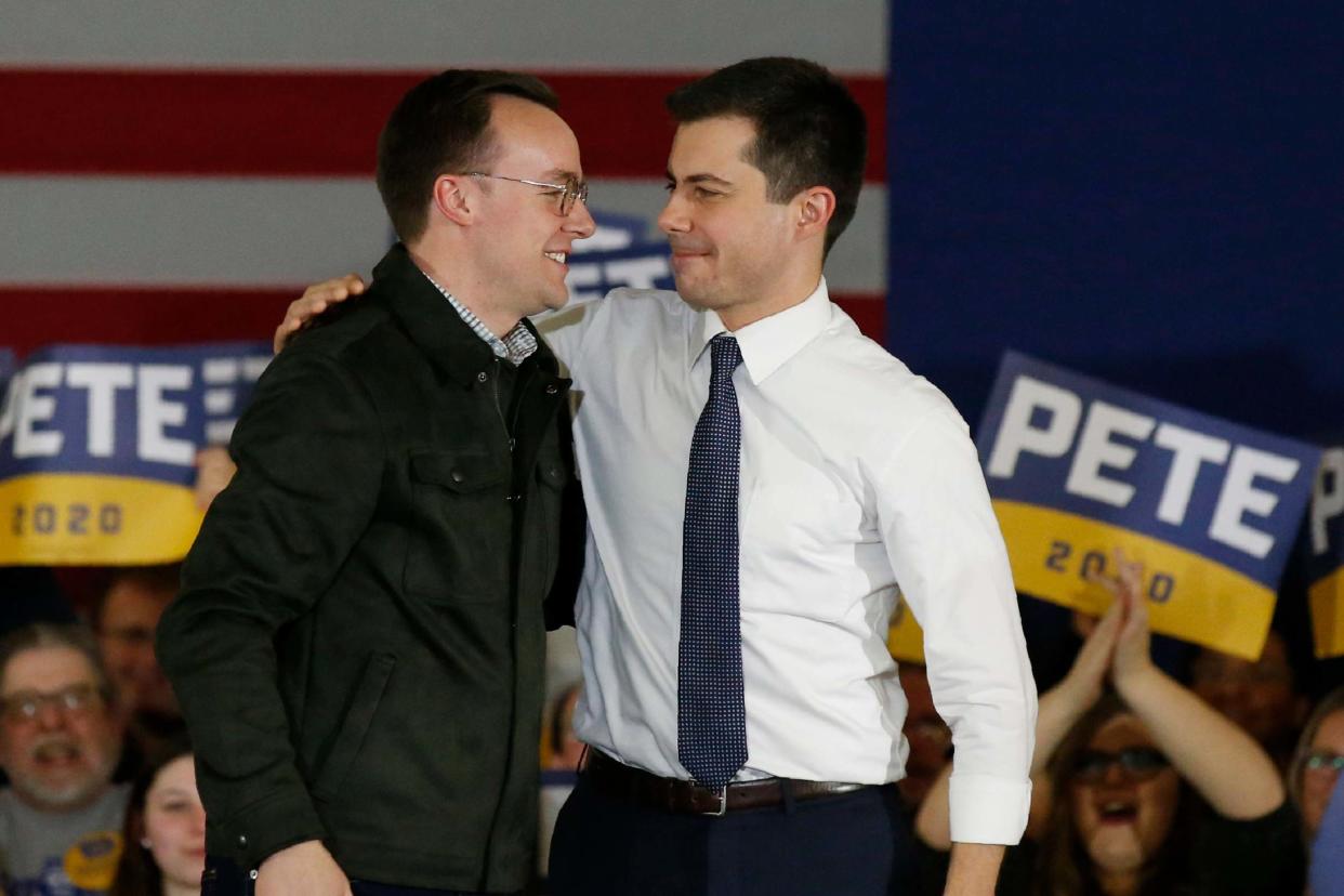 Family values: Pete Buttigieg, right, on stage at a rally with his husband of two years, Chasten Glezman: AP