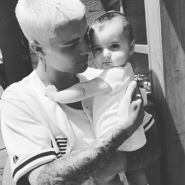 Justin Bieber Breaks Fan Photo Ban with Sweet Instagram Snap of Himself  Holding a Baby