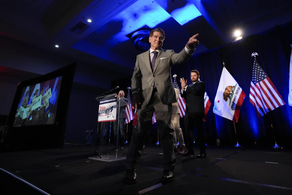 Republican U.S. Senate candidate Steve Garvey points to his supporters as he walks on the stage during his election night party, Tuesday, March 5, 2024, in Palm Desert, Calif. (AP Photo/Gregory Bull)