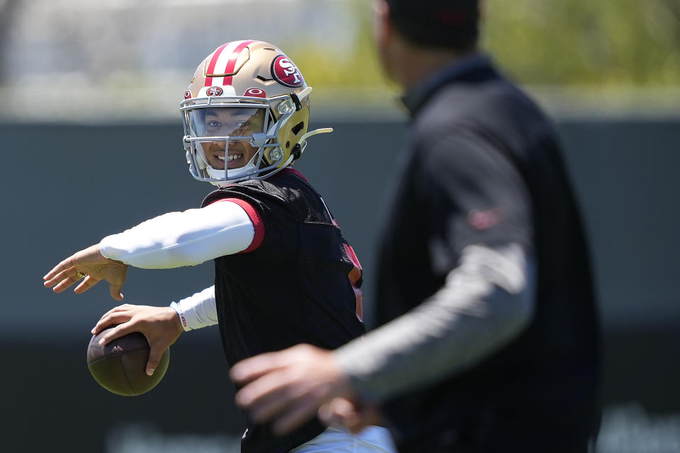 FILE - San Francisco 49ers quarterback Trey Lance takes part in drills at the NFL football team's practice facility in Santa Clara, Calif., Wednesday, June 1, 2022. The offense is set to be turned over to Trey Lance with San Francisco hoping the player they traded three first-round picks to take can be the piece to take the Niners over the top. (AP Photo/Tony Avelar, File)
