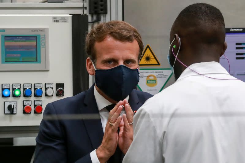 French President Emmanuel Macron visits a factory of manufacturer Valeo, in Etaples