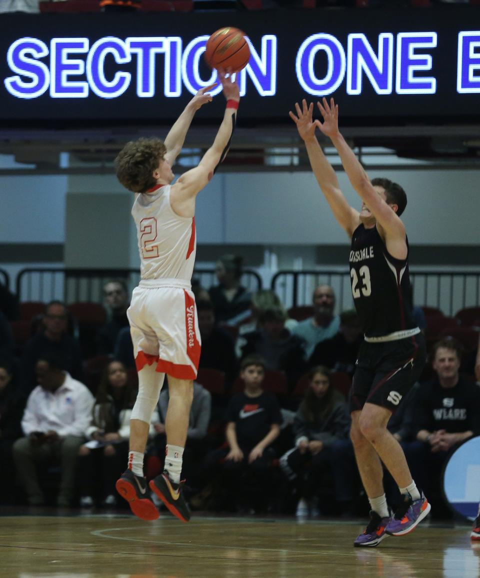 North Rockland's Connor Wein (2) puts up a 3-point shot in front f Scarsdale's Asher Krohn during the boys Section 1 Class AA championship at the Westchester County Center in White Plains March 5, 2023. North Rockland won the game 52-40