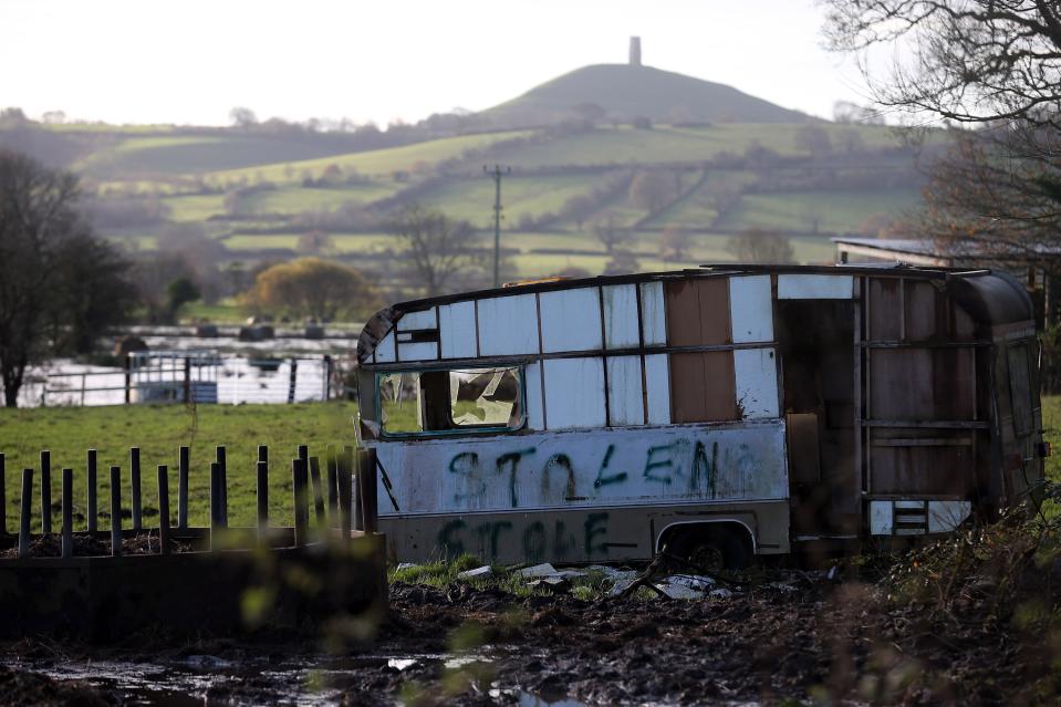 GLASTONBURY, UNITED KINGDOM - NOVEMBER 25: An old caravan stands near flood water in fields surrounding the Glastonbury Tor on the Somerset Levels, on November 25, 2012 near Glastonbury, England. Another band of heavy rain and wind continued to bring disruption to many parts of the country today particularly in the south west which was already suffering from flooding earlier in the week. (Photo by Matt Cardy/Getty Images)