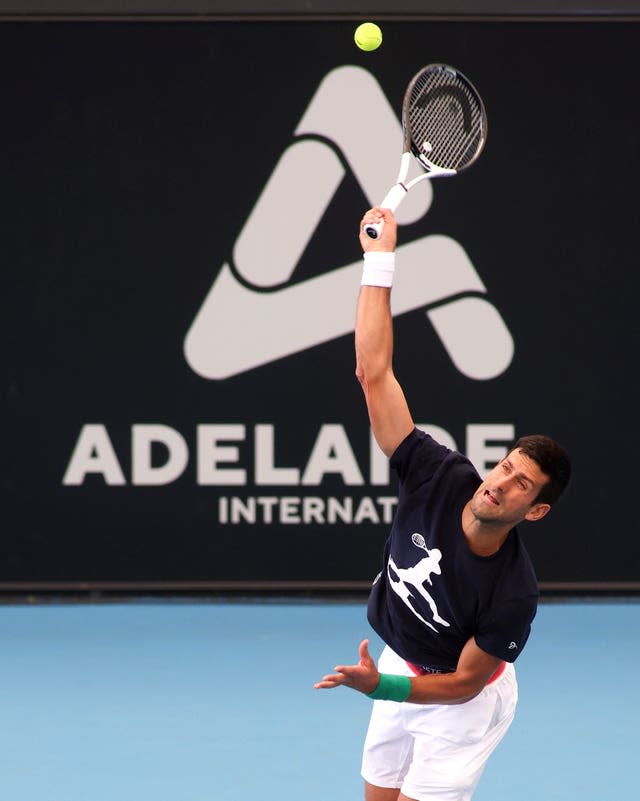 Novak Djokovic serves during practice in Adelaide