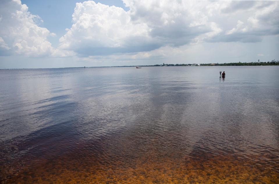 A fisherman tries his luck on the Caloosahatchee River on Friday, June 30, 2023.  