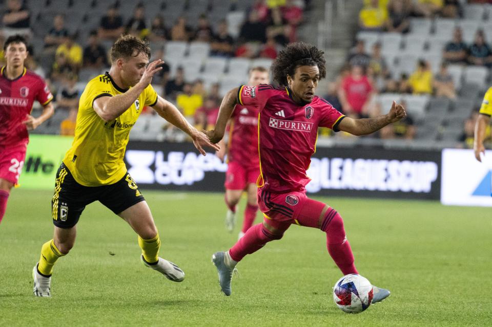 Jul 23, 2023; Columbus, OH, USA; St. Louis City midfielder Aziel Jackson (25) dribbles the ball while Columbus Crew midfielder Aidan Morris (8) defends in the second half at Lower.com Field. Mandatory Credit: Trevor Ruszkowski-USA TODAY Sports