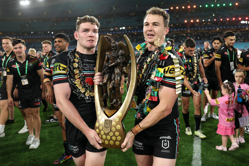 SYDNEY, AUSTRALIA - OCTOBER 01:  Liam Martin and Dylan Edwards of the Panthers hold aloft the Provan-Summons Trophy after winning the 2023 NRL Grand Final match between Penrith Panthers and Brisbane Broncos at Accor Stadium on October 01, 2023 in Sydney, Australia. (Photo by Matt King/Getty Images)