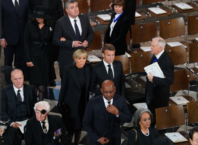 French President Emanuel Macron and wife, Brigitte, arrive for the funeral 