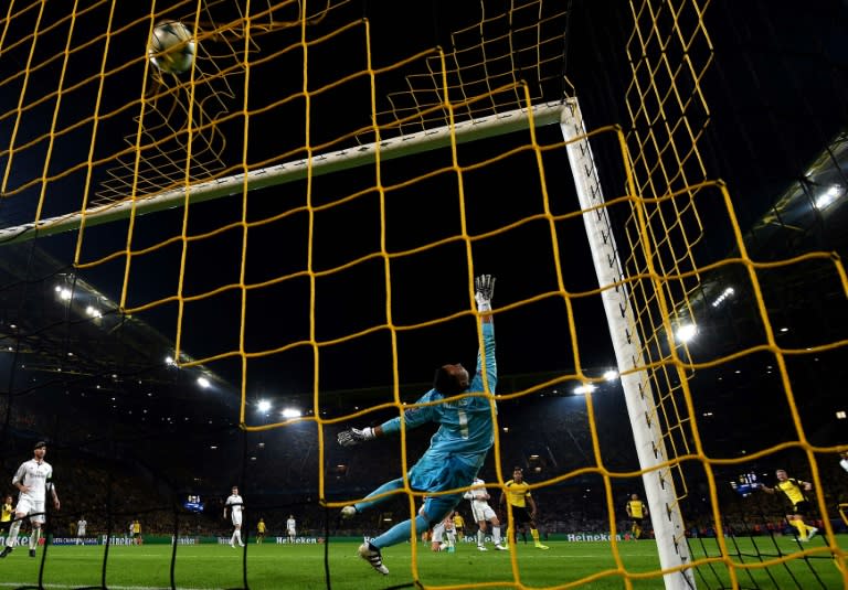 Real Madrid's Costa Rican goalkeeper Keylor Navas tries to catch the ball