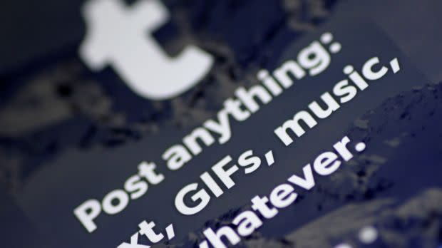A phone displays a screen from Tumblr that says, "Post anything: text GIFs, music, whatever."