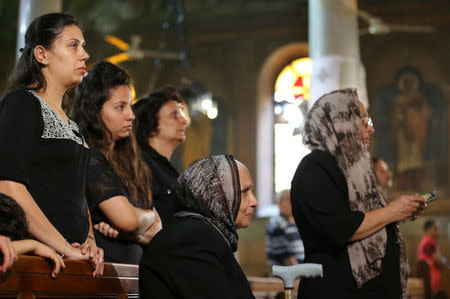 Relatives of the Christian victims of the crashed EgyptAir flight MS804 attend an absentee funeral mass at the main Cathedral in Cairo, Egypt, May 22, 2016. REUTERS/Mohamed Abd El Ghany