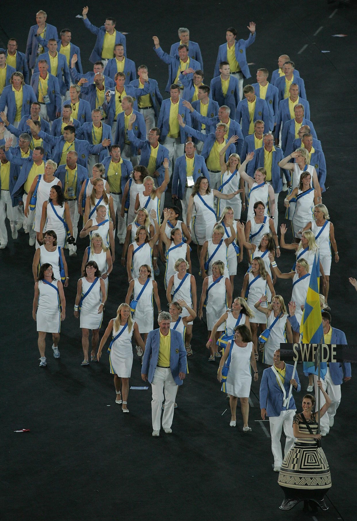 ATHENS - AUGUST 13:  Flag bearer Lars Frolander leads team Sweden during the opening ceremony of the Athens 2004 Summer Olympic Games on August 13, 2004 at the Sports Complex Olympic Stadium in Athens, Greece.  (Photo by Jonathan Ferrey/Getty Images)