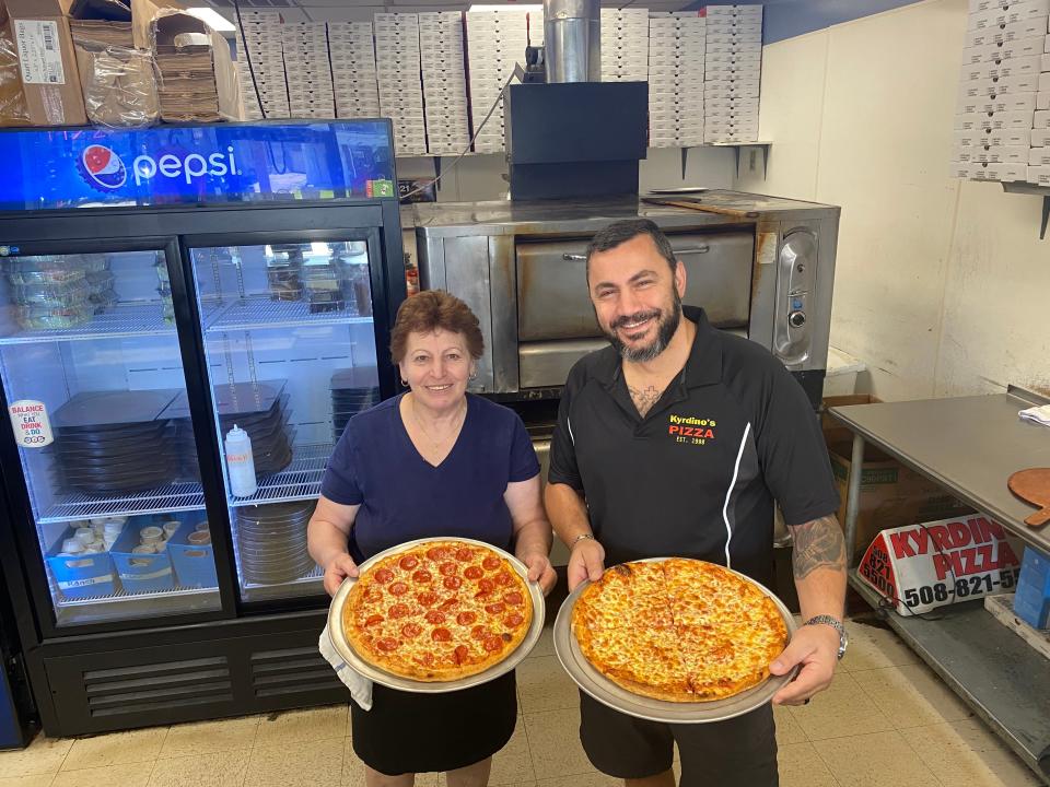 Angelo Llongo, right, owner of family-owned Kyrdino's Pizza in Taunton and his mother Elli Mitsi take pride in their Greek-style pizzas.