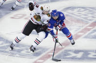 New York Rangers center Ryan Strome (16) skates against Chicago Blackhawks left wing Henrik Borgstrom (13) during the third period of an NHL hockey game Saturday, Dec. 4, 2021, at Madison Square Garden in New York. The Rangers won 3-2. (AP Photo/Mary Altaffer)