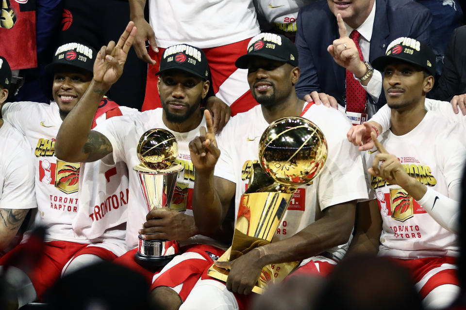 Kawhi Leonard #2 and Serge Ibaka #9 of the Toronto Raptors celebrates their teams victory over the Golden State Warriors in Game Six to win the 2019 NBA Finals at ORACLE Arena on June 13, 2019 in Oakland, California. (Photo by Ezra Shaw/Getty Images)