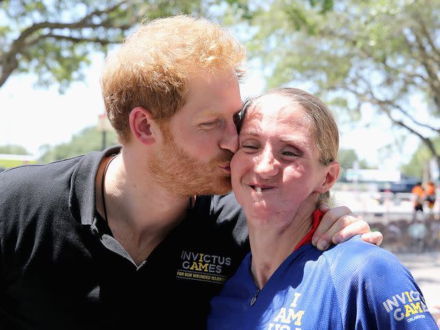 Katie Kuiper of Team USA gets a kiss from Prince Harry at the road cycling event during the Invictus Games Orlando 2016 at ESPN Wide World of Sports on May 9, 2016 in Orlando, Florida.