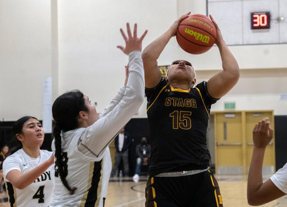 Stagg's Kayla Ogle, left, pulls down a rebound over Chavez's Paulina Sanchez during a girls varsity basketball game at Chavez High School in Stockton on Jan. 18, 2024.