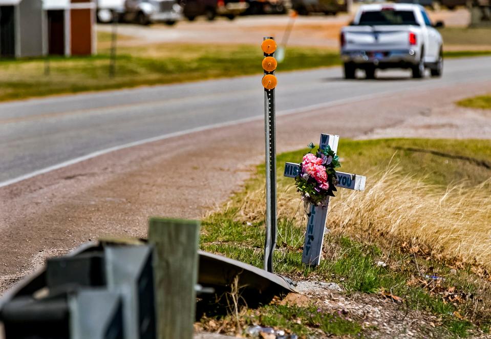 A roadside memorial is shown in Tishomingo, where six high schools died in a car wreck on Tuesday.