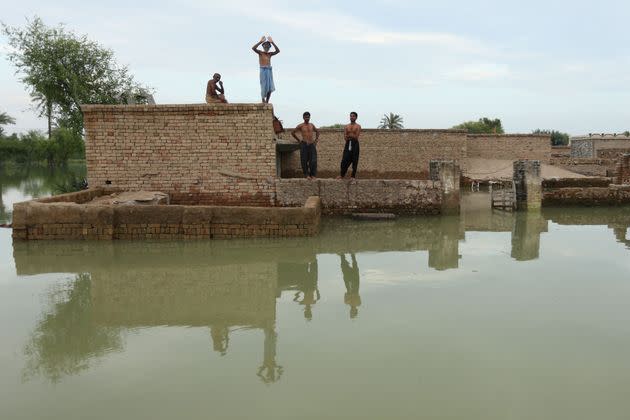 Flood-affected people wait for relief supplies in Dera Ghazi Khan district in Punjab province on Aug. 29, 2022. Tens of millions of people across Pakistan were battling the worst monsoon floods in a decade, with countless homes washed away, vital farmland destroyed and the country's main river threatening to burst its banks. (Photo: SHAHID SAEED MIRZA/AFP/Getty Images)