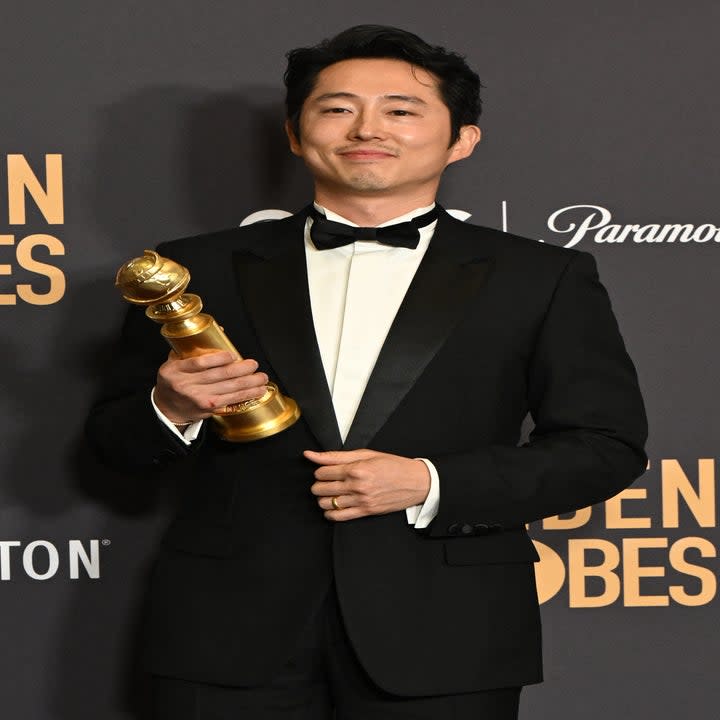 Steven Yeun with his Golden Globe