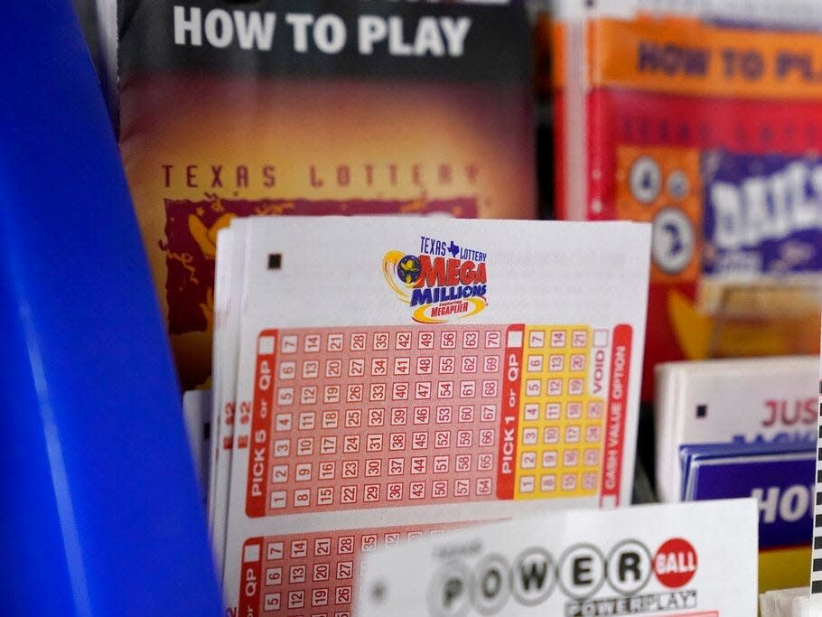 A Mega Millions playing slip sits in a kiosk at a convenience store